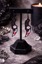 High-quality product images showcasing a pair of bold, gothic-inspired acrylic dangle earrings with a dark, edgy design, captured to highlight detail, size, and overall aesthetic against clean or styled backgrounds.