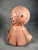 Young Lady in Peach holding matching parasol Young Lady in Peach holding matching parasol