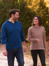 The Vanguard Alpaca Hoodie on a man and woman walking in the outdoors.