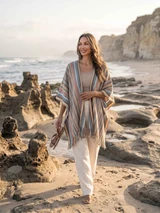 Riviera Fringed Baby Alpaca Wool Ruana on model at beach