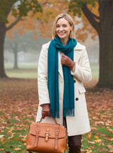 Baby Alpaca Scarf Solid Blue Styled on Model outside with Fall leaves