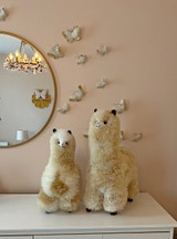 Alpaca Stuffed Animals - Premium, Super Fluffy Baby Alpaca Fur Figures on a bedroom dresser.
