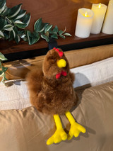 Alpaca Fur Rooster chicken on bed pillows.