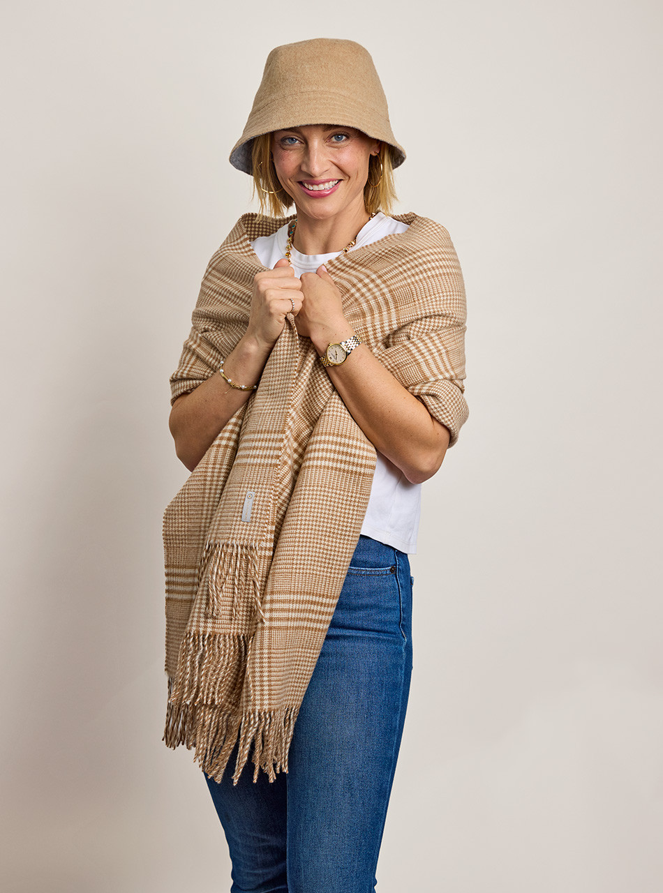 Model wearing reversible alpaca wool bucket hat in studio