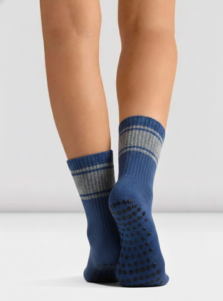 Warrior Retro Crew Grip Socks on legs.