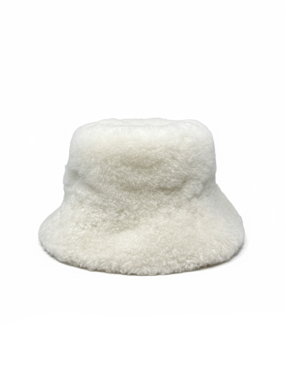 Side profile of alpaca fur bucket hat showing plush brim and shape