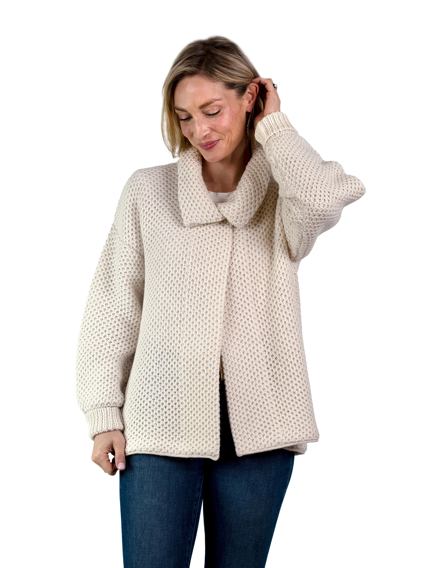 Woman wearing a Cymone baby alpaca cardigan with the front of the sweater closed
