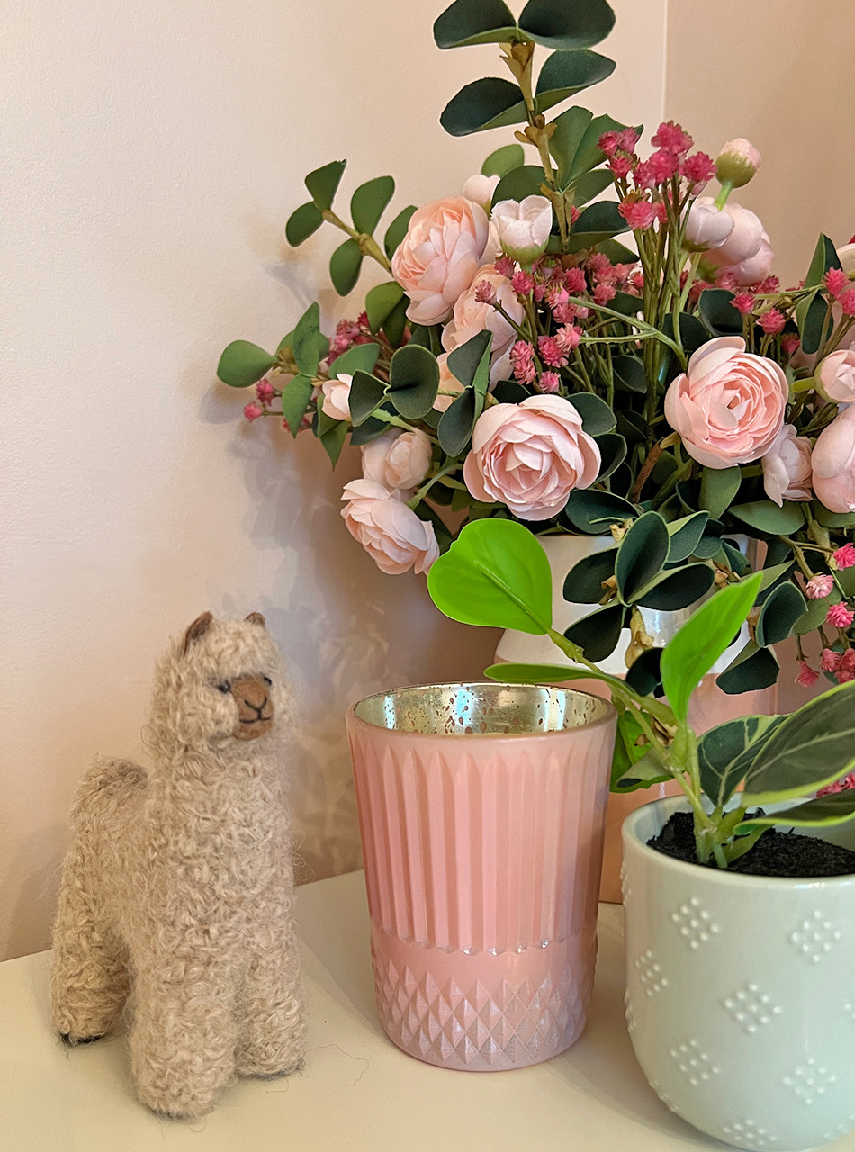 Felted Alpaca Figure with flowers and candle.