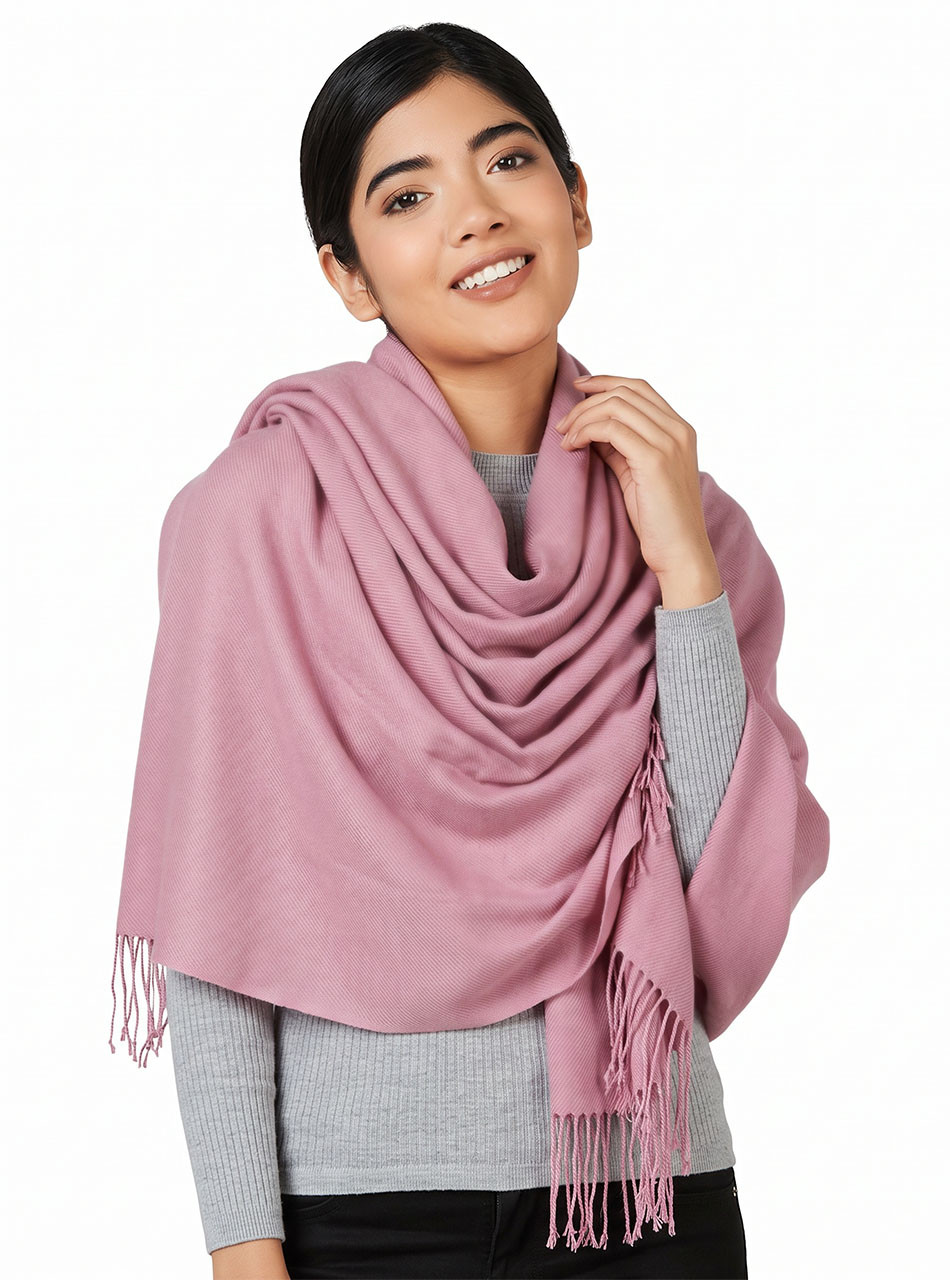 Armory Oversized Baby Alpaca Wrap in Primrose Pink on a woman, worn as a wrap