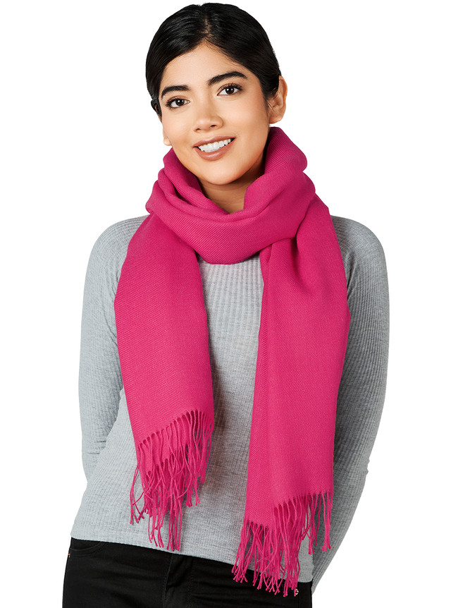 Armory Oversized Baby Alpaca Wrap in Barbie Pink-tastic On woman looped as a scarf.