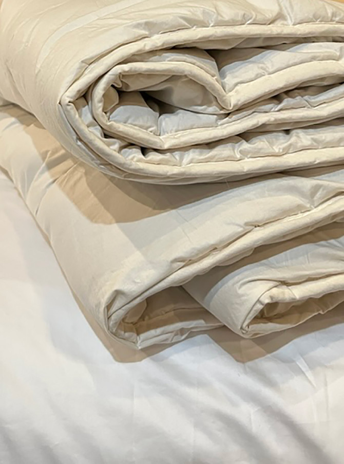 Duvet is unbleached Ecru color, shown here on white duvet cover.