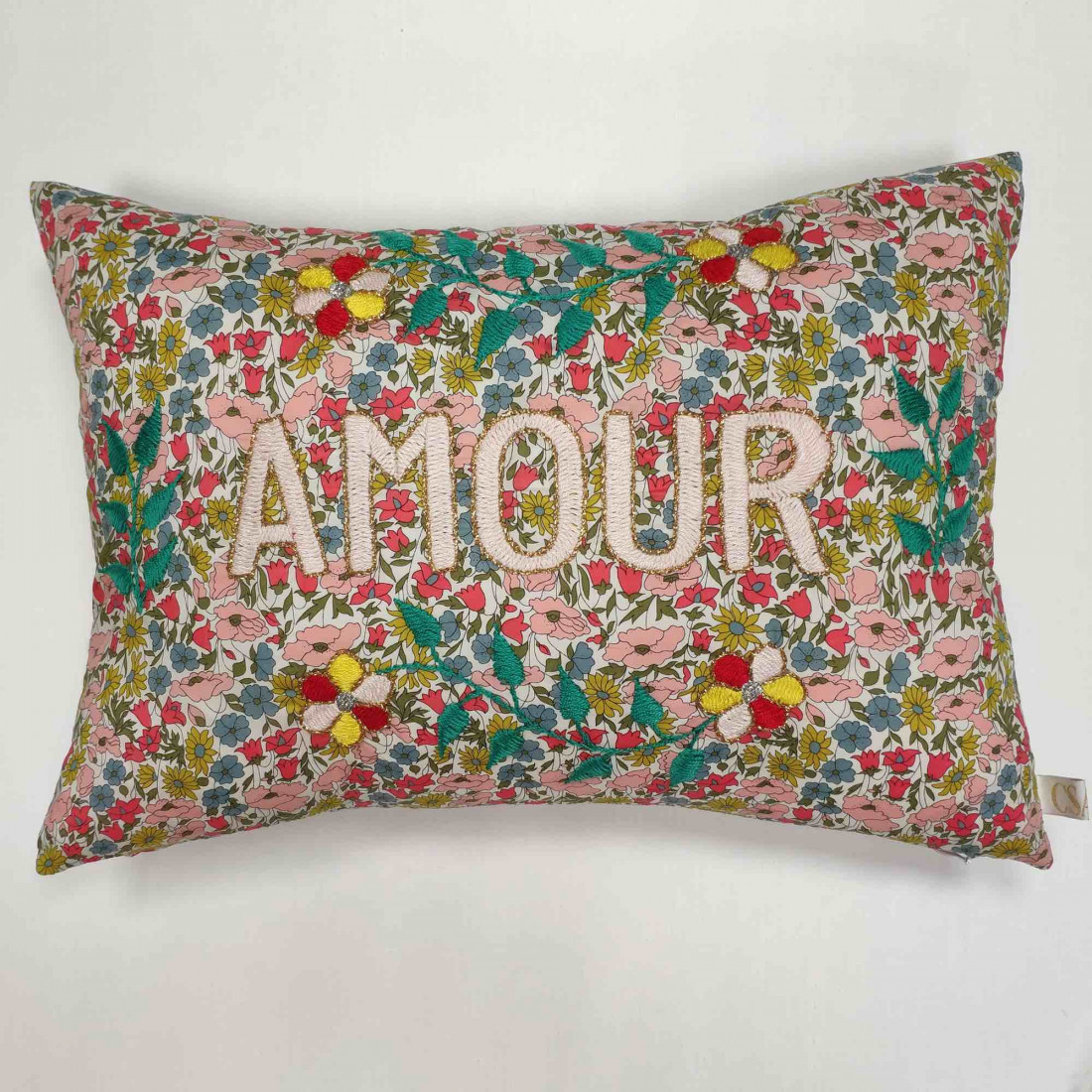 small embroidered pillow