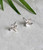 Reticulated silver tiny hydrangea stud earring with 18k gold dot center by Christine Peters of Damariscotta