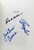 Inside page where book is signed by Coach Hall, Jack "Goose" Givens and James Lee