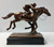 Jockey 11.5"W x 9.5"H copper plated and resin cast