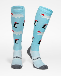 Horse riding socks an ice blue, with polar bears and penguins wearing Christmas hats Horse riding socks an ice blue, with polar bears and penguins wearing Christmas hats