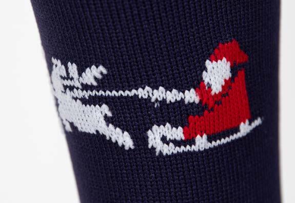 White and red jacquard knitted design on a navy riding sock