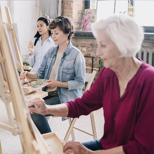 3 women in painting class