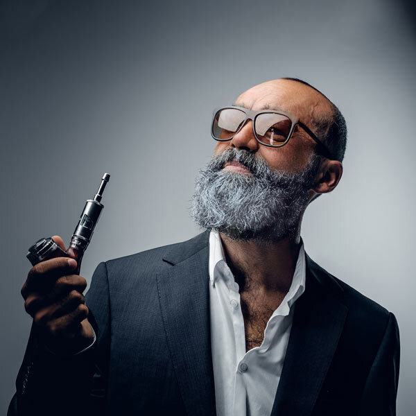 Older bearded man with vape