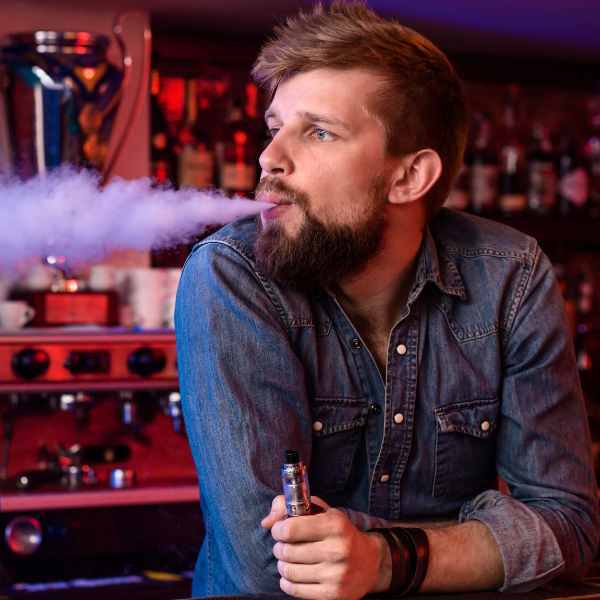 Man Vaping Indoors