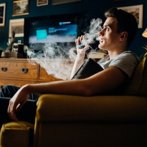 Man Vaping Indoors Man Vaping Indoors