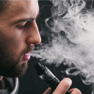 man vaping with a sub-ohm mod device