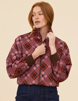 Three-quarter view of a model styling the Renegade Bomber Jacket with the collar turned down, highlighting the comfortable stretch rib cuffs and cozy woven texture.