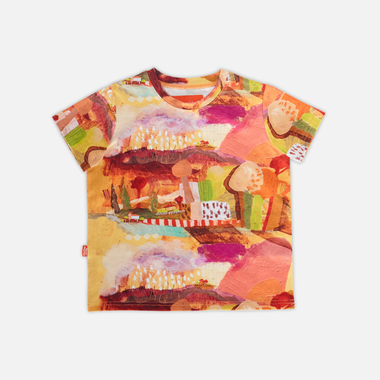 Image shows kids tee shirt laying flat featuring original artwork in golden yellow and orange hues