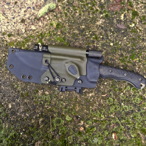 Custom KYDEX Sheath for your knife made with care and expertise. Extreme style sheath includes a button light, firesteel and optional sharpener holder. Designed for scout carry on the back of your belt or as a neck sheath or attach to your pack with a Molle-Lok. Custom KYDEX Sheath for your knife made with care and expertise. Extreme style sheath includes a button light, firesteel and optional sharpener holder. Designed for scout carry on the back of your belt or as a neck sheath or attach to your pack with a Molle-Lok.