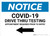 Notice: COVID-19 Drive Thru Testing Left Arrow Landscape - Wall Sign