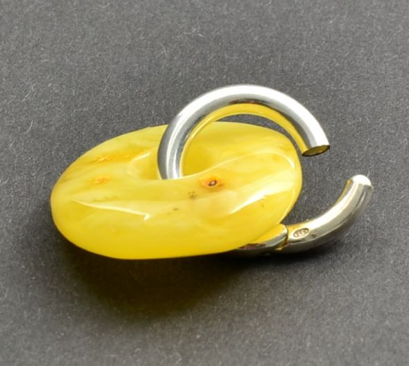 Butterscotch Amber Donut Pendant on Silver Bail.