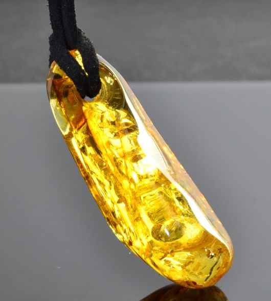Amber Amulet On Black Cord Made of Free Form Golden Amber