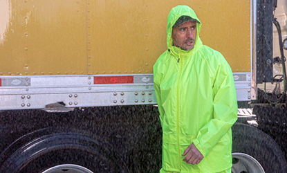 Truck driver wearing hivis waterproof rainwear
