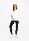 THE UPSIDE women's white Saturn Arrow Sweater is an organic cotton fleece jumper with a relaxed, oversized fit. It features a soft rib at the neckline, handcuffs and cuffs.