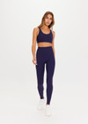 THE UPSIDE women's navy blue Peached 28inch High Rise Pant is a sustainable 28inch full length legging in our recycled soft peached fabric with a V shaped high-rise waistband.
