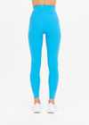 THE UPSIDE Peached 25inch High Midi Pant in Pool Blue is a recycled 25” midi length legging with a V shaped high-rise waistband and printed arrow logo at back.