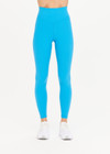 THE UPSIDE Peached 25inch High Midi Pant in Pool Blue is a recycled 25” midi length legging with a V shaped high-rise waistband and printed arrow logo at back.