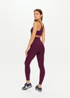 THE UPSIDE women's purple fig Peached 25inch High Midi legging features a high-rise waistband and printed arrow logo at the back.