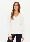 THE UPSIDE women's white Seymour Knit Sweater made with 100% organic cotton cable knit fabrication features a v-shaped neckline, ribbed cuffs, hem and neck, and embroidered arrow logo on back of neck.