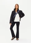 THE UPSIDE women's white Seymour Knit Sweater made with 100% organic cotton cable knit fabrication features a v-shaped neckline, ribbed cuffs, hem and neck, and embroidered arrow logo on back of neck.
