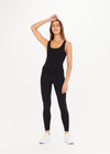 THE UPSIDE women's black, form-fitting Balance Seamless Lenny Tank is made from fabric with moisture control properties and is designed for a soft and supportive fit. This tank top features a scoop neck, cross back straps and shelf bra and bra cups for support.