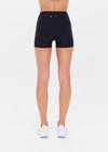 THE UPSIDE women's black Peached 2.5inch Spin Short is a recycled mid-rise spin short in our soft peached fabrication.