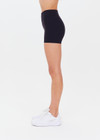 THE UPSIDE women's black Peached 2.5inch Spin Short is a recycled mid-rise spin short in our soft peached fabrication.
