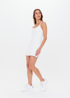 THE UPSIDE women's white scoop neck Peached Brooklyn Dress made with Peached fabric features shelf bra and removable cups, inbuilt shorts with pockets and adjustable straps.