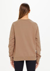 THE UPSIDE women’s brown Newport Crew, made with organic cotton french terry fabric, features a relaxed-fit, rib neck, cuffs and waist, and a tonal printed horseshoe logo on front.