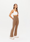 THE UPSIDE women's tan high-rise full length Peached Florence Flare pant made with Peached fabric features white stripe down side seam and split.