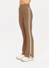 THE UPSIDE women's tan high-rise full length Peached Florence Flare pant made with Peached fabric features white stripe down side seam and split.
