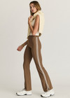 THE UPSIDE women's tan high-rise full length Peached Florence Flare pant made with Peached fabric features white stripe down side seam and split.