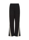 THE UPSIDE women's black Petra Flare is a flared pant with splits at front, contrast knitted tape down side seams, pockets and elastic at waist.