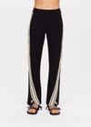 THE UPSIDE women's black Petra Flare is a flared pant with splits at front, contrast knitted tape down side seams, pockets and elastic at waist.